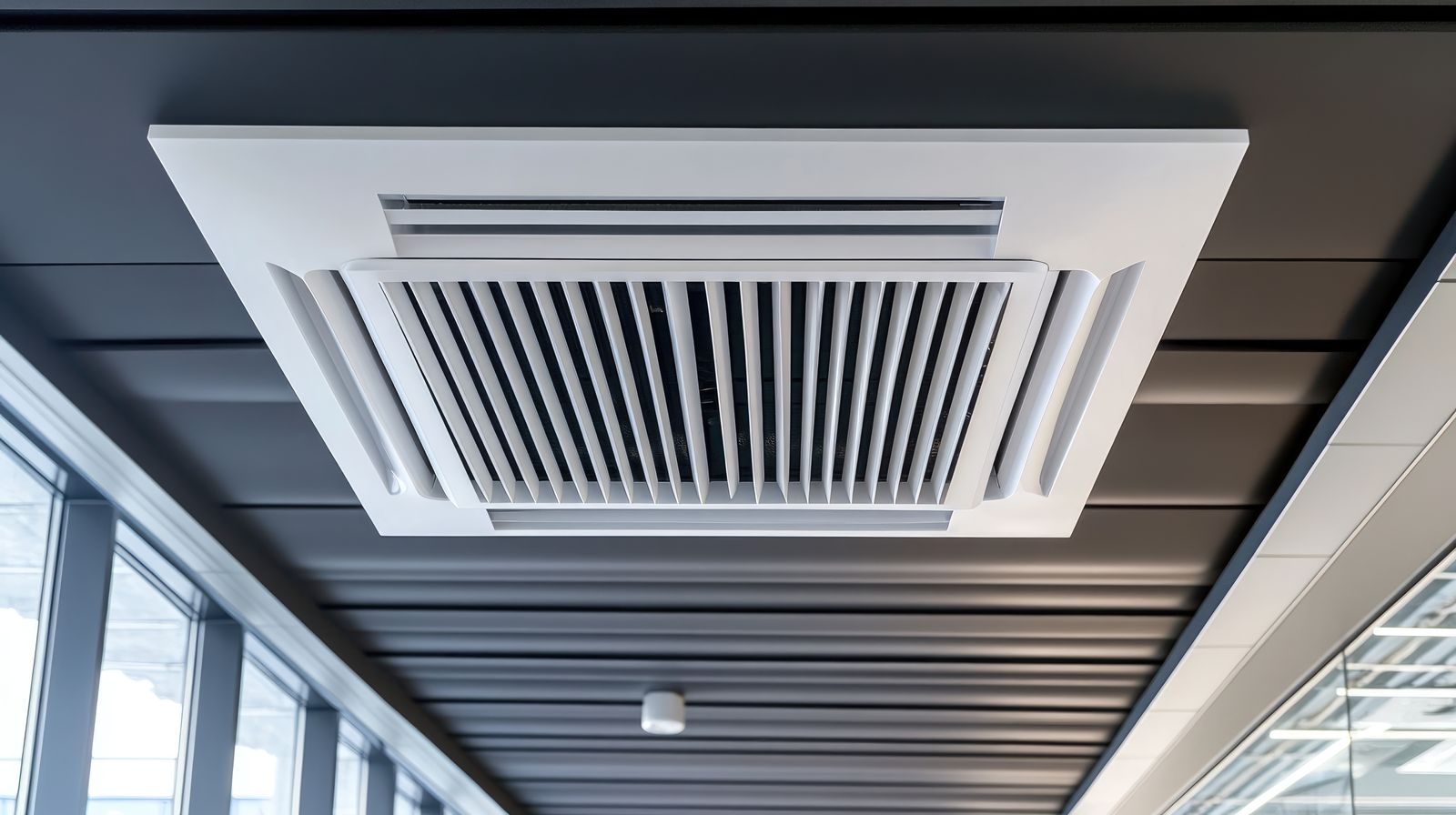 Ceiling air conditioning cassette in a modern office